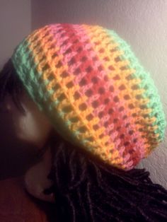 "Hat made with various bright and subdued color acrylic yarns; tie the drawstring to fit the hat however you wish.  The color scheme for this tam was inspired by the legendary TV series, \"Soul Train.\"" Colorful Crochet Casual Hats, Colorful Adjustable Casual Crochet Hat, Colorful Adjustable Crochet Hat, Casual Adjustable Colorful Crochet Hat, Casual Colorful Adjustable Crochet Hat, Colorful Crochet Hat One Size Fits Most, Colorful Crochet Hat One Size, Colorful Yarn Casual Hat, Adjustable Multicolor Hippie Crochet Hat