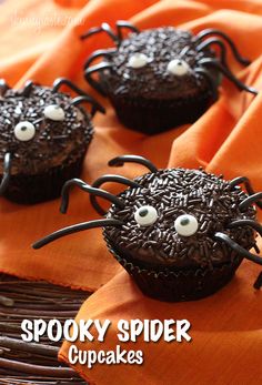 chocolate cupcakes decorated with spooky spider decorations