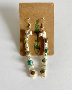 These Earrings are handmade and ethically sourced. They are crafted with wire and brought together with different stones and crystals onto a perfectly natural bone. These Earrings will make any outfit stand out! They are about 3.80, 4 or 4.75 inches long and dangle away from your shoulder with beautiful stones. Even though they might look heavy they are not with weighing only 8 or 15 grams depending on the size! The bones are from a fawn who passed away on our property, they were then collected Deer Bone Jewelry, Bone Crafts Earrings, Animal Bone Jewelry Clay, Diy Bone Jewelry, Bone Earrings Handmade, Bohemian Bone-colored Nickel-free Earrings, Bohemian Bone-colored Pierced Earrings, Bohemian Bone-colored Earrings, Unique Bone-colored Nickel-free Earrings