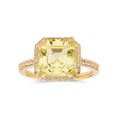 an 18k yellow gold ring set with a cushion cut citrine and diamonds