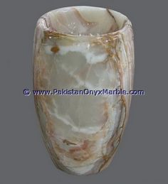 a marble vase is shown on a gray background