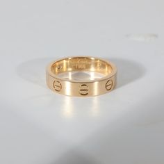 This is part of Chairish’s Fine Jewelry assortment.  Cartier Love Diamond Wedding Band With 1 Diamond in 18K Yellow Gold 0.02 CTW  PRIMARY DETAILS  SKU: 132486  Listing Title: Cartier Love Diamond Wedding Band With 1 Diamond in 18K Yellow Gold 0.02 CTW  Condition Description: Cartier's Love collection is the epitome of iconic, from the recognizable designs to the history behind the line-up. The collection started in 1969 with the bangle bracelet, which is engraved with a circular motif throughou