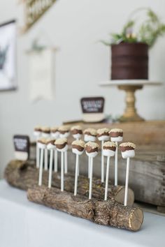 there are many small marshmallows on top of the cake pops in this photo