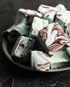 a plate full of green and white desserts