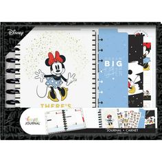 a spiral notebook with mickey mouse on it