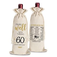 two wine bottles are wrapped in burlocks with the words 60th birthday written on them