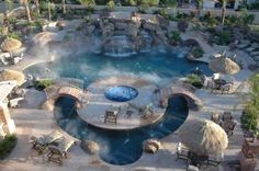 an aerial view of a resort pool and hot springs