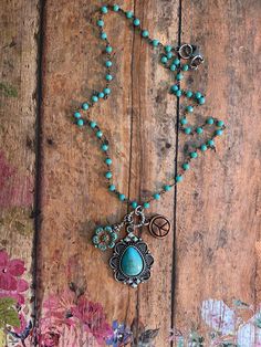 "❤ EveRy DaY WeaR ❤  This DESIGN ~ An array of charms, beads & findings dangle from this 16\" turquoise micro beaded chain. CHARMS selected: Southwestern style drop, czech flower & copper peace sign. jewelry for your heart & soul <-----❤---- NOTE ❤ ---> The listing photos you are seeing are of my original designs. I only change the photos when there is a significant design difference. What this means is, you may receive: a necklace with a different type of bead/charm; a slight difference to the Turquoise Bohemian Charm Necklaces, Turquoise Bohemian Jewelry With Vintage Charm, Bohemian Turquoise Jewelry With Vintage Charm, Turquoise Hippie Necklace For Jewelry Making, Hippie Turquoise Necklaces For Jewelry Making, Bohemian Nickel-free Beaded Necklaces, Hippie Turquoise Necklaces, Turquoise Beaded Adjustable Charm Necklace, Turquoise Beaded Adjustable Charm Necklaces