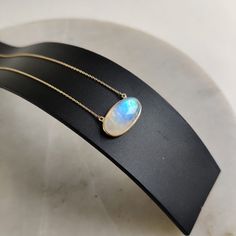 "ITEM DESCRIPTION: This stunning necklace is set in 14k Solid Yellow Gold with Natural Rainbow Moonstone with utmost precision. It is an unique gemstone necklace for nearly every occasion and is completely hassle-free jewelry. ITEM DETAILS: * Gem: Rainbow Moonstone * Gem Size: 10x20mm * Gem Shape: Oval * Gem Weight: 12.54 carats * Gold Purity: 14KT * Gold Weight: 1.29 gram * Total Weight: 3.79 gram * necklace Length: 16\" Inches gold chain. The Gold purity is guaranteed and it comes with authent Oval Moonstone Necklace In Yellow Gold, Moonstone Gemstone Oval Necklace, Oval Moonstone Gemstone Necklace, Handmade Jewelry Box, Rainbow Moonstone Pendant, Blue Moonstone, Bezel Pendant, June Birthstone, Natural Rainbow