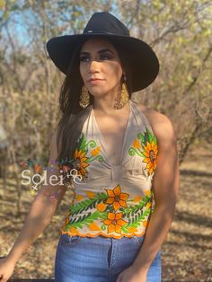 This Beautiful Sunflower Embroidered Halter Top is the perfect Top for Everyday use or a special event. It is comfortable, with elastic on the back and has a tie around the neck for an adjustable fit. This blouse comes in one size which fits sizes Small and Medium. Mexican Top, Floral Halter Top, Mexican Blouse, Womens Halter Tops, Pretty Top, Halter Tops, Floral Top, Chicago Il, Halter Top