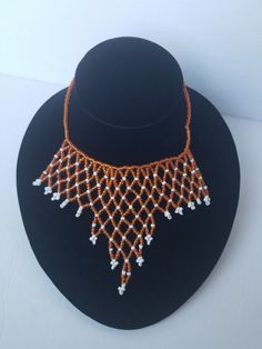 Hand crafted with beads and a wire. The triangle choker necklace fits perfectly around the neck. The beads are shiny and elegant. Can be worn for many occasions. Thanks for visiting my shop. Come again Stay safe https://www.etsy.com/shop/naistumityujewelry Adjustable Triangle Beaded Jewelry, Adjustable Triangular Beaded Jewelry, Necklace African, Multi Strand Beaded Necklace, Purple Gift, Triangle Necklace, Beaded Collar, Best Gifts For Her, The Triangle