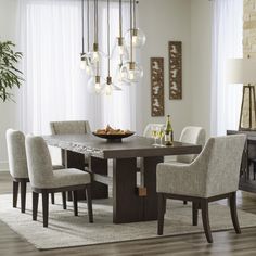 a dining room table with chairs around it