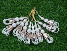 Silver Latkan for blous Lehenga HandBags Hangings Dupatta Decoration Bridal Wedding dress for Women pair Thread Fringe Beaded latkanof 2 pcs Designer's Den Tassels For Women wedding Handmade Hanging bridal heavy Tassels Lehange Fancy Beautiful Pair of Latkans & Brooch Accessory For You Decorative Products. In Indian These Latkans Are Normally Used as The Accessory For Lengha & Sari Blouse On The Back, But These Can Be Used in Many Other Ways to Metal & Pearl scan be used at an door. Muzaffarpur Luxury Yellow Gold Chandbalis With Latkans, Luxury Chandbalis With Latkans For Women, Luxury Chandbalis With Latkans For Wedding, Cheap Elegant Danglers With Latkans, Luxury Latkans Danglers For Reception, Latkan For Blouse, Lengha Sari, Wedding Dress For Women, Blouse Lehenga