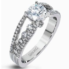 a white gold engagement ring with diamonds on it