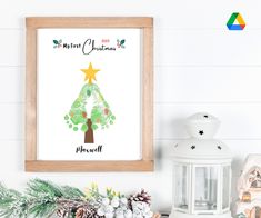 a christmas tree with a star on it is displayed in front of a white wall