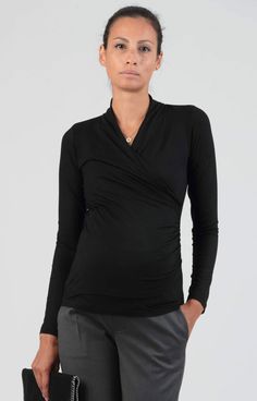 Versatile and beautiful, our long sleeved maternity and nursing top is available in Bordeaux. Made of soft, stretch and comfortable viscose jersey that drapes beautifully over your bump. The crossover wrap neckline is flattering throughout pregnancy and very practical for nursing. Just pull to one side for easy breastfeeding access once baby arrives. Pair with jeans for a daytime look or with smart trousers for a night out with friends. / Soft viscose jersey maternity top in Black / Suitable for Maternity Occasion Dress, Maternity Wedding Dresses, Tiffany Rose, Pregnant Wedding, Pregnant Wedding Dress, Nursing Top, Party Kleidung, Smart Trousers, Pregnancy Stages