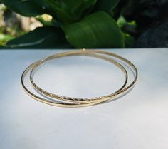 A special & Personal Order made for Jacquelin Tolin using her own old gold. I can turn your scrap gold into a masterpiece, and you get to pay only 1/3 of the price! These (2) 18K bangles are listed for $970.00 and Jacqui only paid $300.00 because we used her own gold. Best deal you can possibly get for your old broken scrap gold! Just convo me for details Weight 10 grams, 6 cm diameter 18K Solid Gold 2+ mm half round Hammered Yellow Gold Bangle For Anniversary, Handmade Yellow Gold Bangle For Anniversary, Handmade Yellow Gold Bracelet For Anniversary, Scrap Gold, African Bracelets, Dream Bracelet, 40th Birthday Gifts, Sterling Silver Bangles, Custom Bracelets