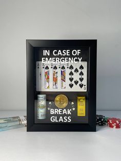 an image of a framed card game with poker chips and playing cards in front of it