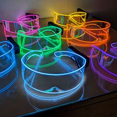 glowing glasses are sitting on top of a table