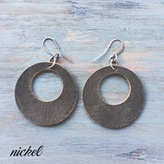 "Bold leather circle earrings perfect for everyday. These earrings feature nickel, english tan or expresso leather paired with simple ear wires in antique brass, antique silver, or antique copper. Lightweight and easy to wear - you might forget you are wearing them! I use only genuine U.S. tanned leather from either Horween (Chicago) or Wickett and Craig (Pennsylvania). The leather will age beautifully and develops fabulous character over time. And these are the same leathers I use in my single Handmade Minimalist Leather Earrings, Minimalist Leather Earrings For Everyday, Minimalist Brown Hoop Earrings For Everyday, Everyday Brown Metal Earrings, Brown Nickel-free Hoop Earrings For Everyday, Nickel-free Brown Hoop Earrings For Everyday, Everyday Nickel-free Leather Jewelry, Minimalist Nickel-free Brown Earrings, Minimalist Brown Nickel-free Earrings