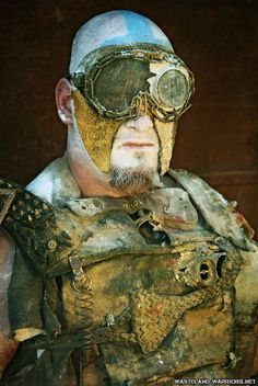 a man wearing goggles and leather gear