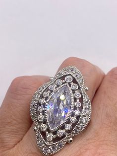 Vintage filigree ring All pave set Cubic Zirconia in Sterling Silver  Detailed cocktail ring  Size 6  Our jeweler can really size this for a $20 fee  All rings are shipped in a nice gift box.   Check out our over a THOUSAND great reviews Engraving is $4 per letter and is not always perfect depending on the piece. It can take a few days if the jeweler is busy. This is payable to Paypal Judithsltd@gmail.com Classic Cubic Zirconia Ring, Exquisite Cubic Zirconia Anniversary Rings, Oval Diamond Filigree Jewelry, Marquise Cluster Ring With Diamond Accents In Cubic Zirconia, Exquisite Cubic Zirconia Pear-shaped Rings, Exquisite Pear-shaped Cubic Zirconia Rings, Luxury Filigree Cubic Zirconia Jewelry, Luxury Silver Marquise Cut Ring, Luxury Silver Pear-shaped Rings