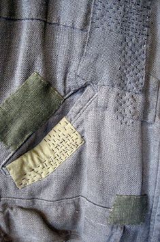 there is a patch in the back pocket of a jacket that has been stitched together