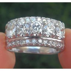 an image of a wedding ring with diamonds on it