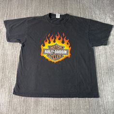 a black harley davidson shirt with flames on it