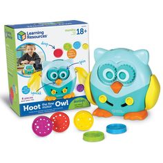 the learning resources owl is next to its box