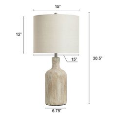 a table lamp is shown with measurements for the base and fabric lampshade on each side