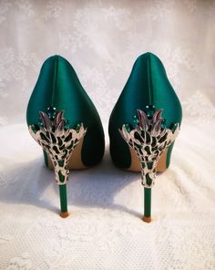 Step into elegance and sophistication with these stunning Emerald Green Satin Shoes. Perfect for a Gothic Wedding or as bridesmaid shoes, these heels are designed to make a statement. The rich emerald green color of the satin fabric exudes luxury, while the sleek design adds a touch of femininity. With a comfortable heel height, these shoes offer both style and functionality. Whether you're celebrating your big day or attending a special event, these Emerald Green Satin Shoes will surely turn heads and make you feel like a true fashionista. Specifications: 1.Heel Height: 9cm 2.Closure Type: slip-on 3.Colour: emerald green.Please do not that the colour isn't forest green,military green or bottle green. These shoes can be ordered with or without clutch. Fit: 1) If your feet are narrow and th Elegant Green Heels With 4-inch Heel, Glamorous Green Heels With Closed Toe, Glamorous Fitted Green Heels, Glamorous Green Closed Toe Heels, Glamorous Green High Heels, Elegant Green Heels For Party, Elegant Green Evening Heels, Elegant Green Heels For Evening, Green Heels For Gala