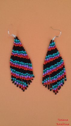 These handmade author's earrings are made of high-quality Czech beads and strong synthetic thread.In these unique earrings I use my author's scheme . Color: black,turquoise, green, purple, red, orange. I will make these earrings for you in your color. 100% hand made with love! Measurements: Length with hook -9,5 cm ( 3.74 inch ),Width -3 cm (1.18 inch) Materials: Silver plated ear hooks Czech glass beads Tytan Thread Unique Black Beaded Dangle Earrings, Multicolor Traditional Beaded Earrings, Bohemian Multicolor Beaded Earrings With Black Beads, Purple Beaded Dangle Earrings With Black Beads, Unique Handmade Black Beaded Earrings, Purple Dangle Beaded Earrings With Black Beads, Unique Black Beaded Earrings With Dangling Beads, Purple Dangle Earrings With Black Beads, Black Beaded Earrings With Colorful Beads For Gifts