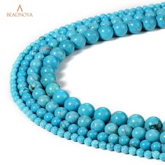 a strand of turquoise beads on a white background