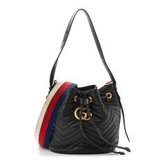 This is an authentic GUCCI Calfskin Matelasse Sylvie Web GG Marmont Bucket Bag in Black. This structured bucket bag is crafted of soft calfskin leather in black with a beautifully stitched chevron pattern. It features an adjustable leather shoulder strap, an optional striped canvas strap, a top cinch cord and an aged gold GG logo. On the back of this beautifully crafted bag, there is a heart stitched design. This bag opens to a rose beige microfiberinterior with patch pockets. Gucci Soft Leather Shoulder Bag For Daily Use, Daily Use Gucci Soft Leather Shoulder Bag, Gucci Leather Pouch Bag, Gucci Soft Leather Bag For Daily Use, Gucci Leather Bag With Removable Pouch, Designer Gucci Bucket Bag With Detachable Strap, Gucci Soft Leather Shoulder Bag, Gucci Bucket Bag With Gold-tone Hardware, Gucci Bucket Bag With Gold-tone Hardware For Travel