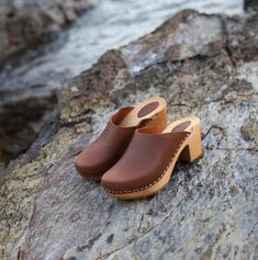 Casual Wooden Clogs With Wooden Heel, Closed Toe Mules With Wooden Heel, Wooden Closed Toe Clogs With Wooden Heel, Comfortable Brown Clogs With Rubber Sole, Natural Closed Toe Mules With Wooden Heel, Comfortable Leather Clogs With Wooden Heel, Wooden Slip-on Mules, Wood Slip-on Mules, Brown Wooden Open Heel Clogs