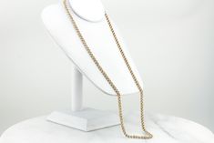 This gorgeous, vintage gold chain has a warm, textured sheen that is both eye catching and regal! Intricately woven knots of polished gold cascade beautifully down the neck and the smooth links feel luxurious against the skin! This is a beautiful piece to wear alone or it could be combined with a large pendant to transform into an outstanding statement piece! Metal: 14K Yellow Gold Width of Chain: 4.2 mm Length of Chain: 28 Inches Marks: "14K" Stamped on the clasp Elegant Oval Link Rope Chain Necklace, Elegant Formal Gold Chain Rope Necklace, Elegant Formal Gold Rope Chain Necklace, Elegant Yellow Gold Rope Chain Necklace With Curb Detail, Formal Gold Rope Chain Link Necklace, Elegant Gold Rope Chain Necklace, Elegant Yellow Gold Curb Chain Necklace, Formal Rope Chain Necklace, Elegant Gold Figaro Rope Chain Necklace