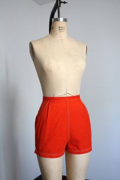 "Vibrant orange high waisted pin up style shorts from the 1950s. Cotton shorts with high waist and pockets! Metal zipper up the back.  Label: Alfred Paguette  Measurements: { xsmall } Waist: 24\"  Hips: 35\" Length: 13\" Rise: 13\" Condition: great vintage condition with a few teeny marks and minor signs of wear - sold as found. washed and ready to wear ☆Shop more☆ http://www.trunkofdresses.com/" Retro Orange Summer Shorts, Orange Retro Summer Shorts, Retro Orange Bottoms With Pockets, Fitted Short Orange Bottoms, Fitted Short Length Orange Bottoms, High Waist Fitted Orange Shorts, Fitted Orange Shorts With Built-in Liner, Orange Fitted High-waisted Shorts, Fitted Orange Shorts With Built-in Shorts