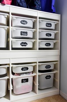 the closet is filled with white plastic containers