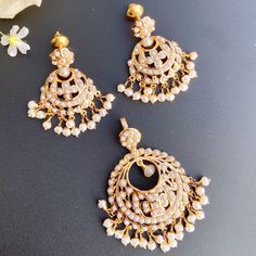 Featured is a chandbali styled pendant set in 22k gold set with freshwater pearls. The pendant set weighs 19.75 gms including 1.80 gms in the hanging pearl beads. Traditional Festive Jewelry Set With Pearl Pendant, Festive Traditional Jewelry Set With Pearl Pendant, Traditional Pearl Pendant Jewelry Set For Celebration, Kundan Chandbali Jewelry Set With Pearl Drop, Diwali Temple Jewelry Set With Pearl Drop, Temple Jewelry Pearl Chandbali Sets, Traditional White Jewelry Set With Pearl Pendant, Festive Pearl Pendant Earrings, Pearl Chandbali Temple Jewelry Jhumkas