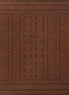 an orange and brown rug with geometric designs