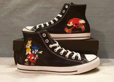 Stand out from the crowd with these unique and exclusive custom designed Converse Hi Tops black canvas shoes! 100% beautifully hand-painted and splash-resistant Sonic themed canvas shoes. These would be perfect as a birthday gift, bride and groom wedding shoes or as a personalized gift! Each canvas shoe is uniquely designed and hand painted. There may be a slight variation in the colour or placement of the design, but I always make sure you will get a top quality design and finish.  The products Black Casual Sneakers With Custom Artwork, Casual Customized Black Sneakers, Casual Black Customized Sneakers, Black Hand Painted Custom Sneakers With Round Toe, Artistic Black Sneakers With Custom Artwork, Black Low-top Sneakers With Custom Artwork, Sonic The Hedgehog Custom Shoes, Custom Hand-painted Black High-top Sneakers, Spiderman Converse High Tops