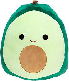 an avocado shaped pillow with a face drawn on it's front and side