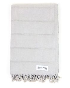 an image of a blanket with fringes on the bottom and one side that says sunkseed