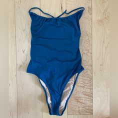 A Pretty Ruched Neckline, Sexy High-Cut Leg And Adjustable Crossback Straps Make This The Perfect Suit For Sun-Soaked Days. Lace Up Back. Pacific Ocean Blue. Fully Lined. Polyamide/Elastane. No Tags But New And Never Worn. One-piece Swimwear With Ruched Back For Beach Season, Ruched Backless Bodysuit For Pool, Backless Ruched Bodysuit For Pool, Blue Swimwear With Drawstring For Sunbathing, Blue Ruched Stretch Swimwear, Beach Bodysuit With Ruched Detail, Ruched One-piece Bodysuit For Beach Season, Summer Ruched Bodysuit For Pool, Blue Fitted One-piece For Poolside