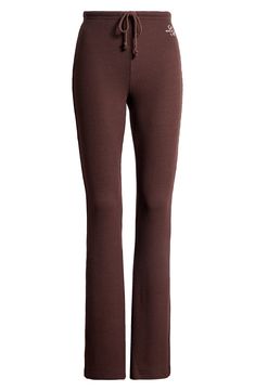 Cut from a textured knit, these drawstring pants have plenty of stretch to keep you feeling comfy no matter what the day brings. 32" inseam; 20" leg opening; 9" front rise; 14" back rise (size Medium) Drawstring waist 68% polyester, 28% rayon, 4% spandex Machine wash, dry flat Imported Casual Brown Ribbed Bottoms, Casual Ribbed Brown Bottoms, Brown Ribbed Pants For Fall, Comfortable Brown Bottoms For Fall, Brown Stretch Bottoms For Loungewear, Stretch Brown Bottoms For Loungewear, Brown Knit Loungewear Bottoms, Brown Loungewear Pants With Ribbed Waistband, Brown Pants With Ribbed Waistband For Loungewear