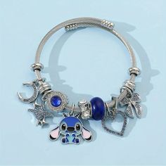 Stitch From Lilo & Stitch Disney Charm Bracelet Brand New In Package Charming Stitch Cartoon Anime Silvery Bracelet - Cute Zinc Alloy With Rhinestone Accents Unique 1 Size Fits All (Adult Or Child) Metal Wrap-Around Cuff Style, With Alloy, Rhinestone And Metal Floating Charms, Beads And Spacers. All Buyers Get Premium Boutique Packaging! Most Orders Receive A Deluxe Gift Bag (Including Treats Such As Hand Cream, Lip Gloss, Face Masks, Scrunchies, &/Or Trial Sized Beauty Items) I Strive For Botto Stitch Bracelets Disney, Stitch Jewelry Disney, Bracelet Bags, Disney Charm Bracelet, Boutique Packaging, Disney Charm, Disney Charms, Stitch Cartoon, Floating Charms