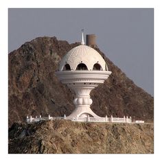 a large white structure sitting on top of a mountain