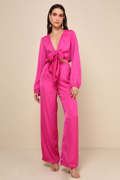 Take your daily looks to iconic new levels with the Lulus Trendsetting Direction Magenta Satin Tie-Front Wide-Leg Jumpsuit! Sleek woven satin shapes long balloon sleeves (with elastic at the cuffs) that frame a functional tie-front bodice with a V-neckline and a flirty cutout detail at the front. Banded waist has stretchy elastic at the back, and tops wide legs that end at ankle-grazing hems. Hidden zipper/clasp at side of pants. Fit: This garment fits true to size. Length: Floor length. Size me Lulu Pants, Lulu Fashion, Pants Fit, Long Balloons, Wide Legs, Daily Look, Wide Leg Jumpsuit, Balloon Sleeves, Hidden Zipper