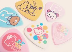 six hello kitty guitar picks with different designs